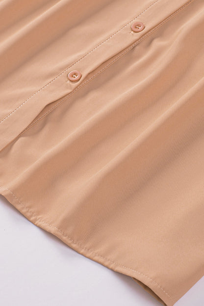 Chemisier boutonné à manches bouffantes de couleur unie