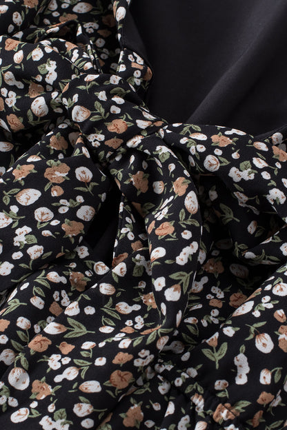 Blusa de manga larga con volantes y lazo delantero con estampado floral