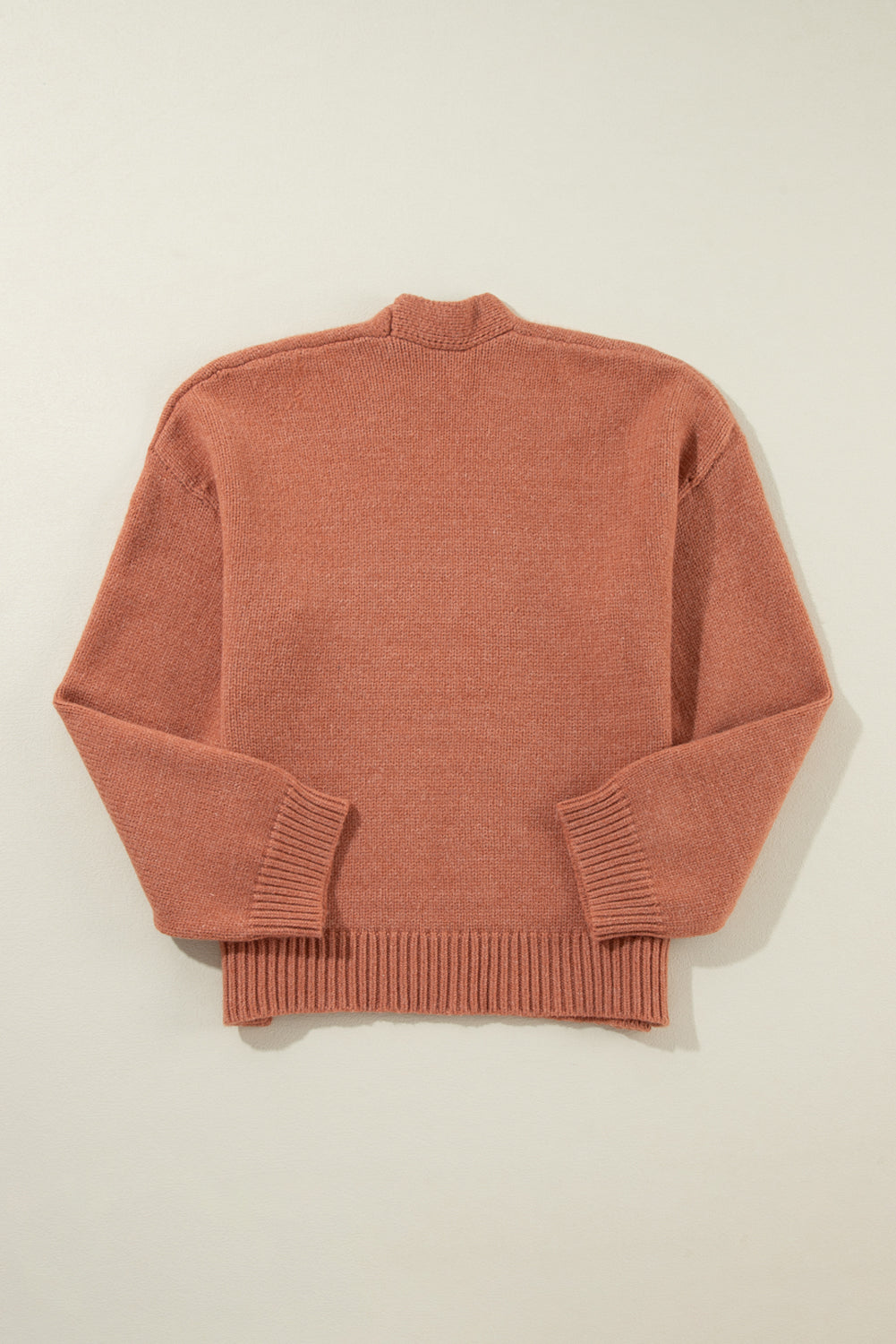 Cardigan court ouvert sur le devant beige clair à épaules tombantes