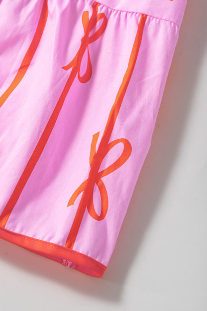 Robe grande taille à volants et taille cintrée avec nœud rose