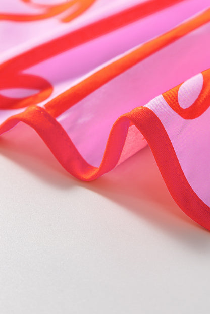 Robe grande taille à volants et taille cintrée avec nœud rose