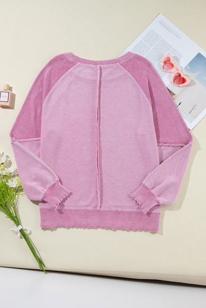 Sweat-shirt raglan rose en maille gaufrée avec coutures apparentes