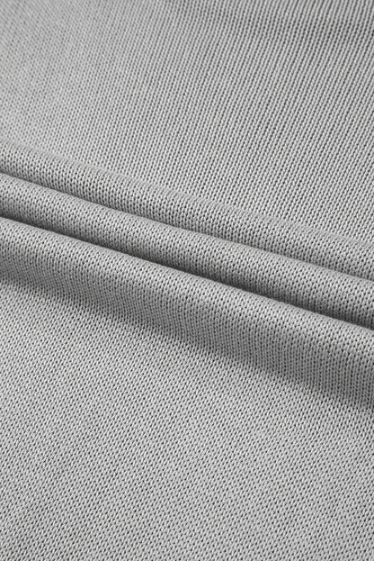 Pull gris uni à manches passe-pouce et bords côtelés