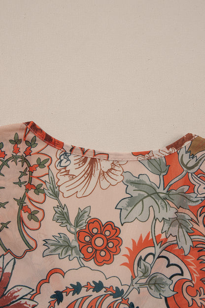 Chemisier orange à imprimé floral, col en V profond, manches cloche et nœud