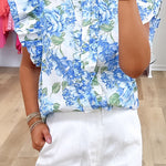 Chemise boutonnée à volants et imprimé floral bleu ciel