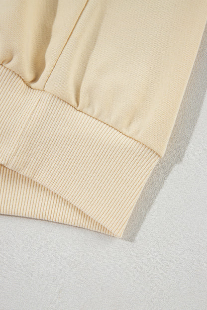 Sweat-shirt beige à manches boutonnées et épaules tombantes