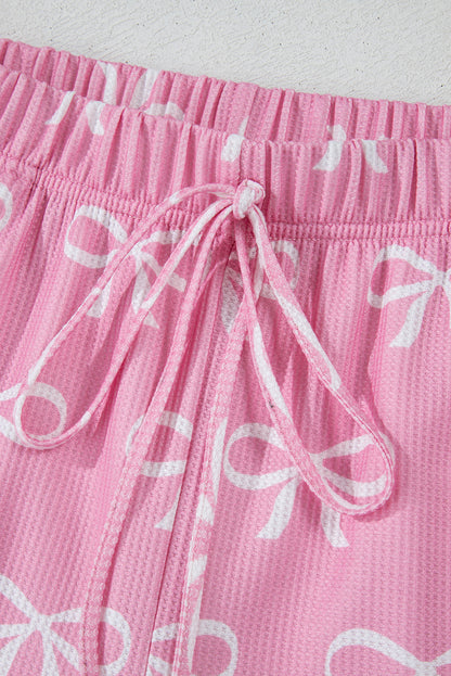 Ensemble t-shirt col V et short en tricot gaufré rose imprimé nœud papillon