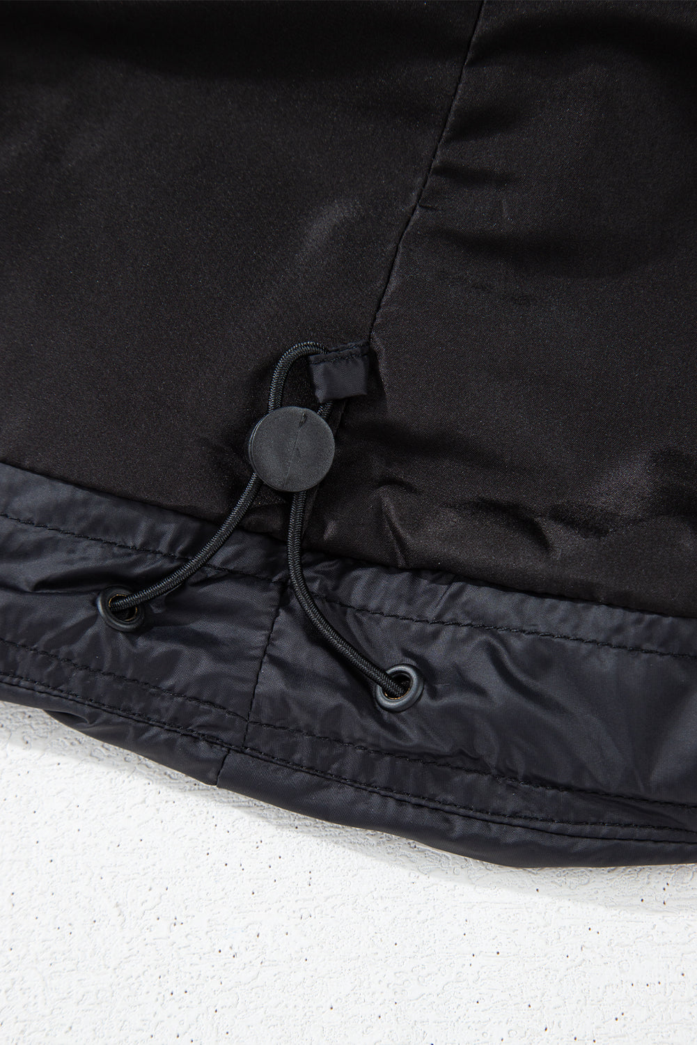 Veste matelassée noire à col montant et fermeture éclair