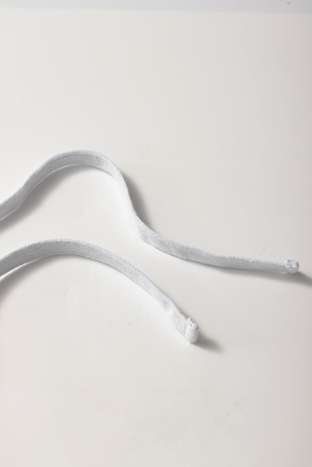 Mini-jupe en molleton gris clair avec cordon de serrage et poches