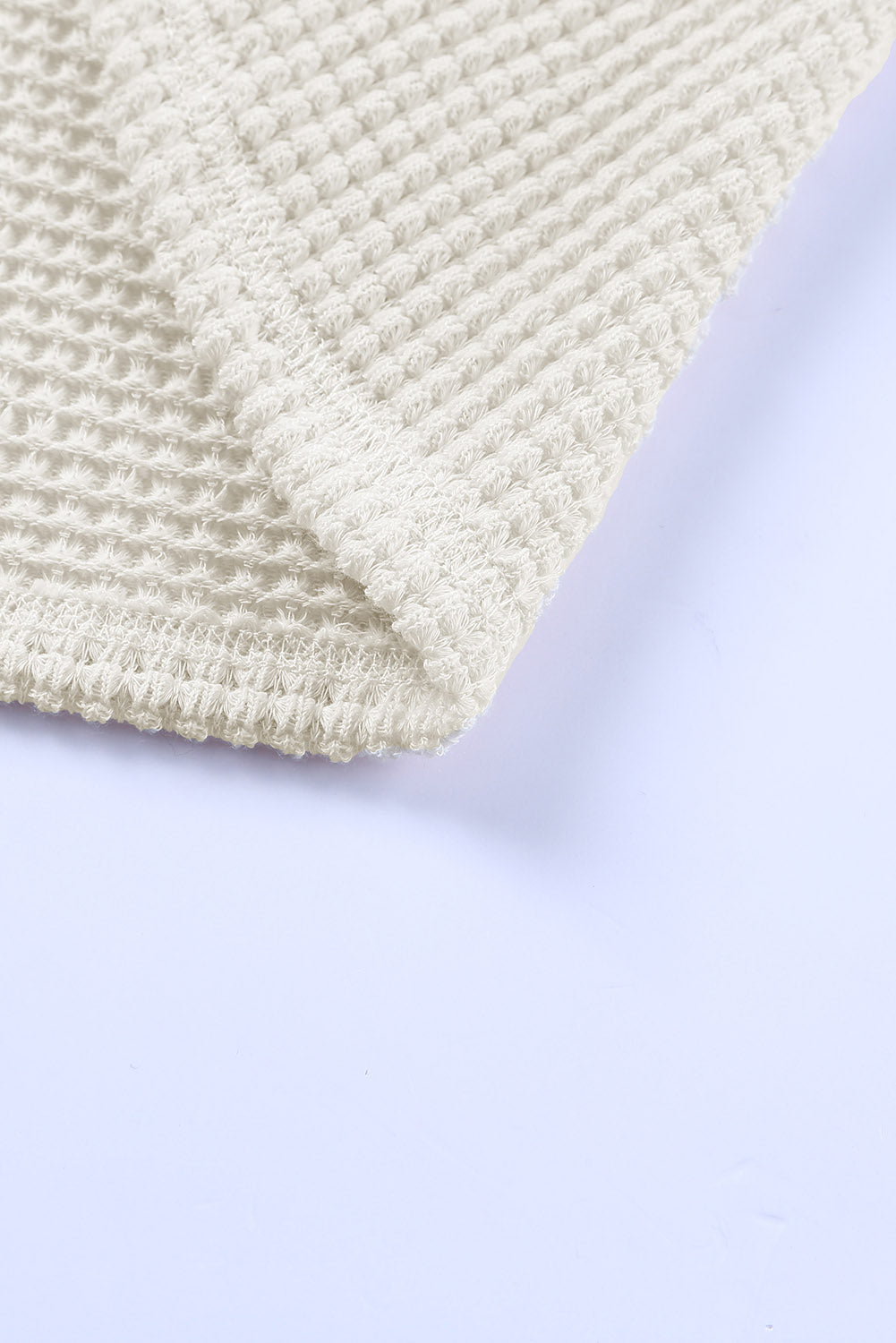 Haut ample en tricot gaufré à col fendu et poches