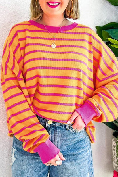 Pull ample à rayures orange, col rond, épaules tombantes