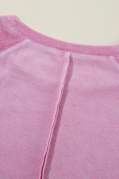 Sweat-shirt raglan rose en maille gaufrée avec coutures apparentes