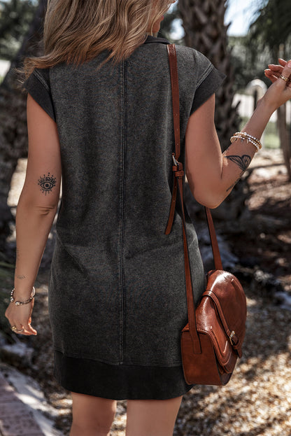 Robe sweat-shirt noire à manches courtes et poches zippées