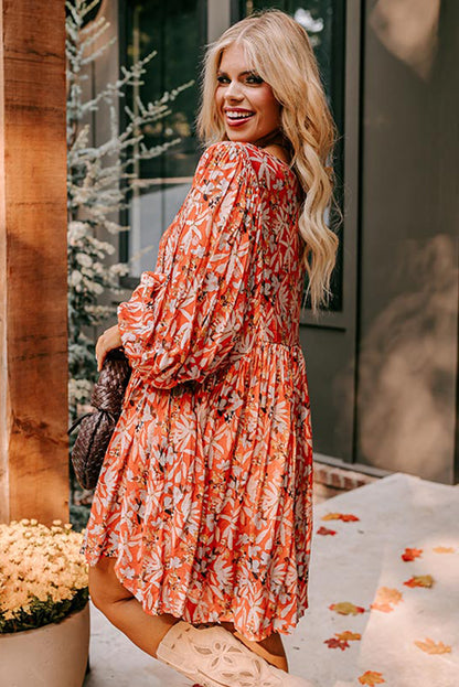 Robe mi-longue orange à imprimé floral, col en V, manches bouffantes, grande taille