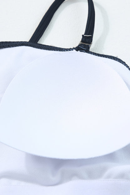 Maillot de bain une pièce bleu marine côtelé avec cordon de serrage et découpes sur les côtés