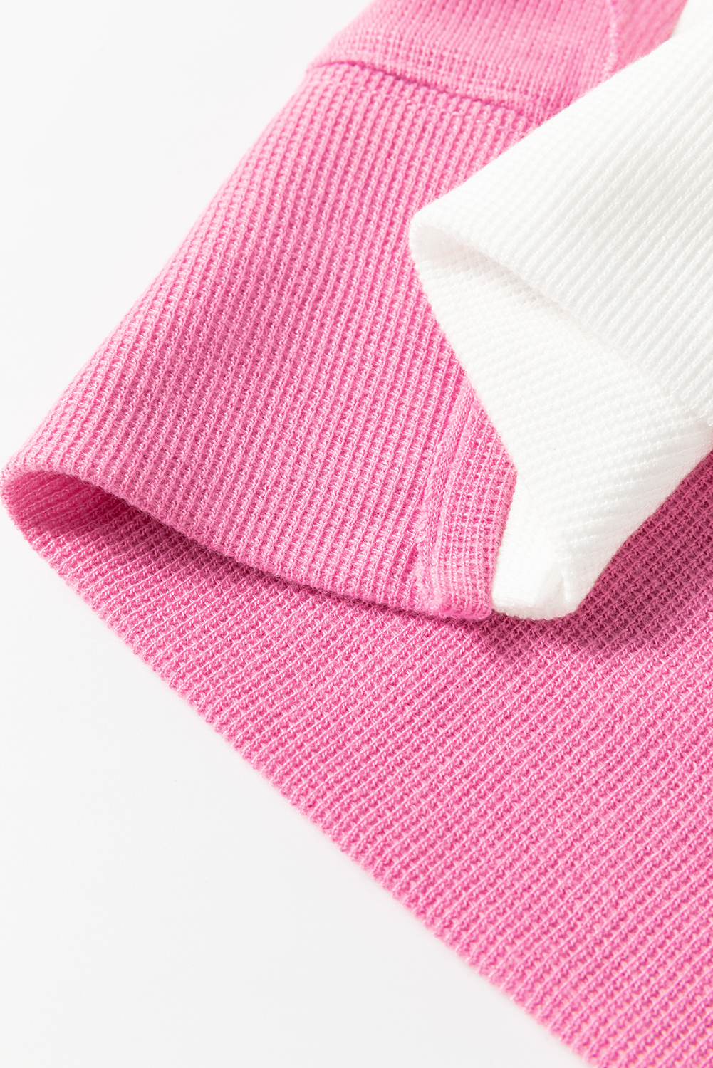 Haut à manches longues en patchwork de couleurs rayées à coutures apparentes rose sachet