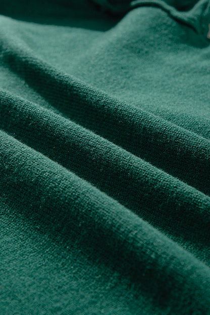 Pull à épaules tombantes et bordure rayée vert noirâtre