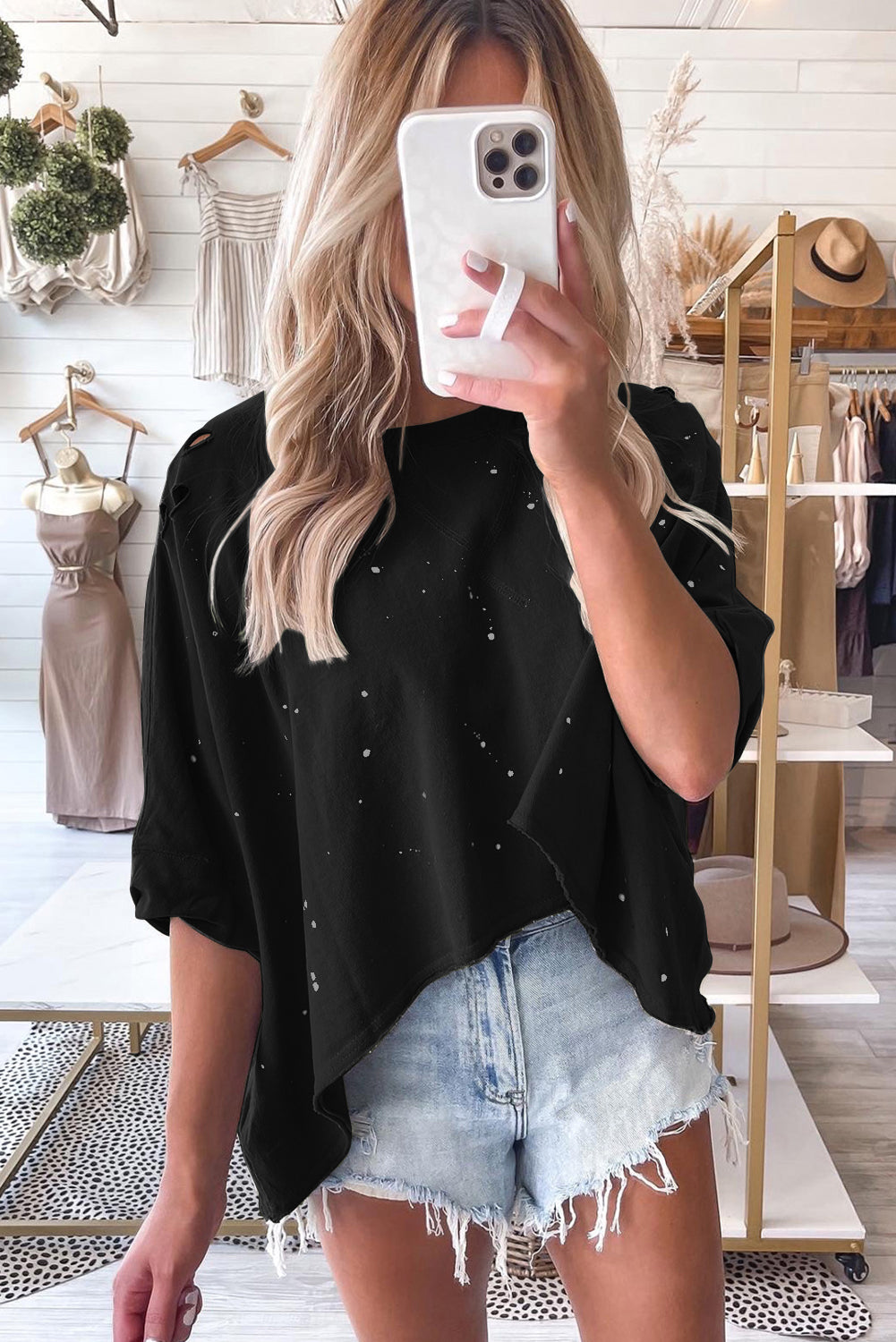 Haut à manches courtes et ourlet asymétrique délavé et vieilli