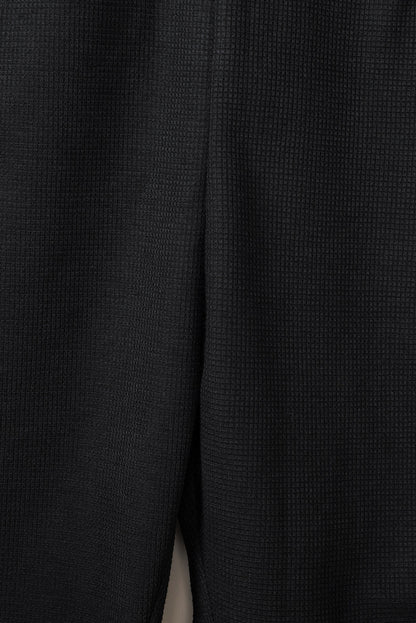 Mono casual texturizado sin mangas con cuello en V y bolsillos