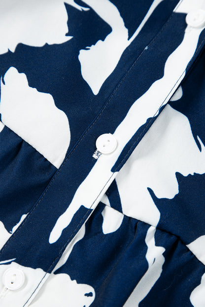 Chemisier bleu voile à imprimé floral abstrait et manches bouffantes à demi-boutons