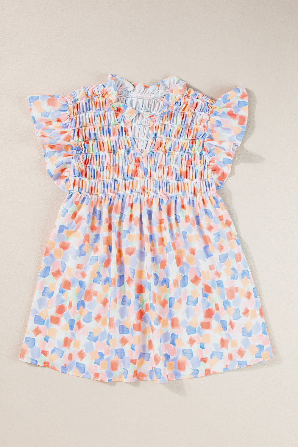 Chemisier rose à imprimé abstrait et à volants