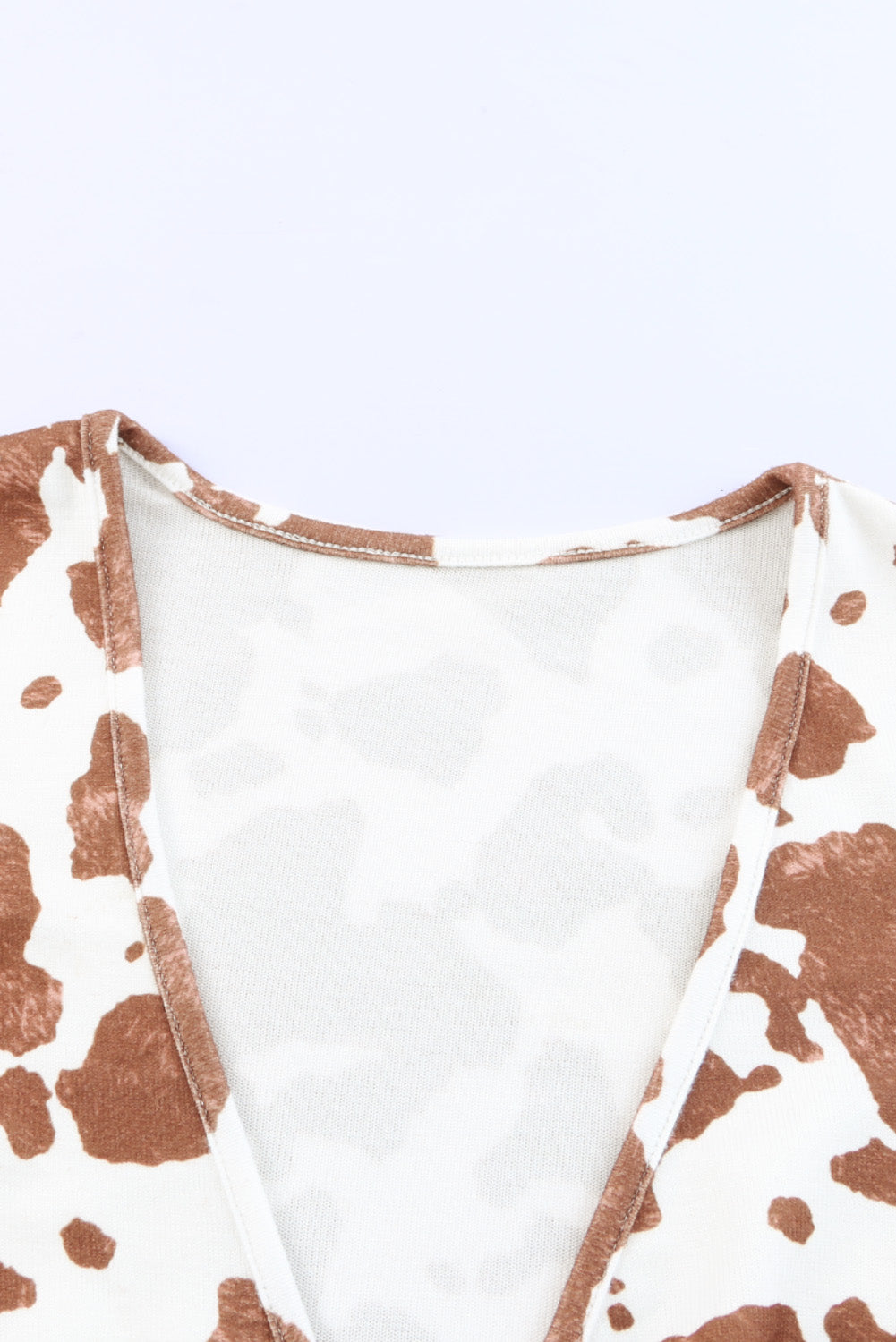 Body de manga larga con cuello en V profundo y estampado de vaca