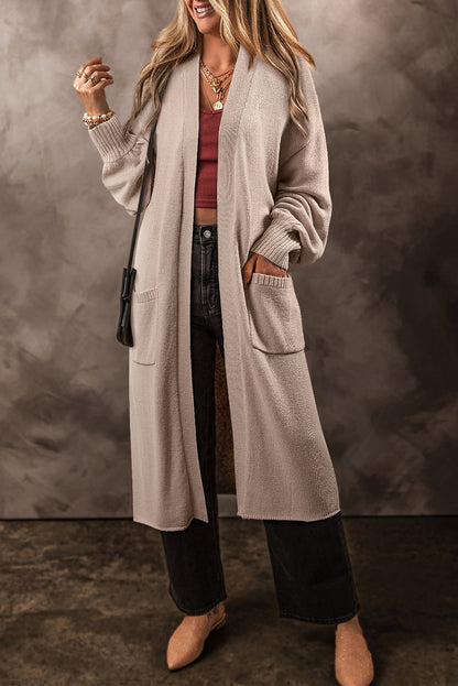 Cardigan long en maille beige ouvert sur le devant avec poches latérales
