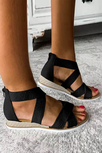 Sandalias de cuña baja con cremallera y tiras cruzadas en beige