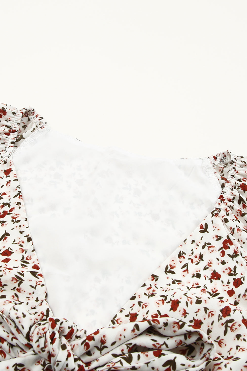 Blusa de manga larga con volantes y lazo delantero con estampado floral