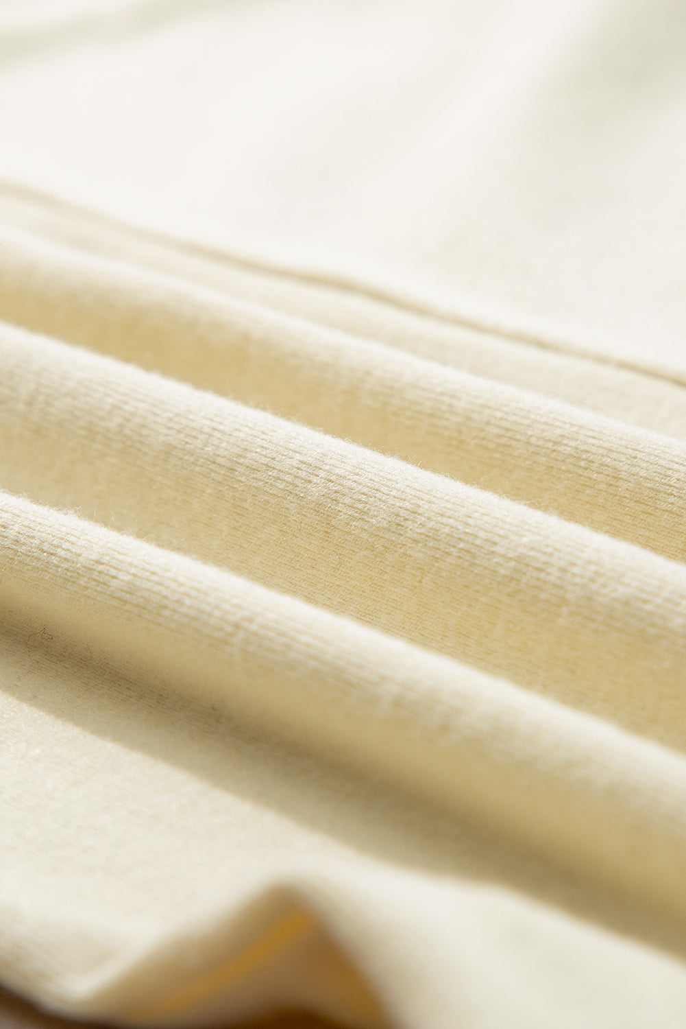 Haut beige à manches longues en tricot thermique avec coutures apparentes