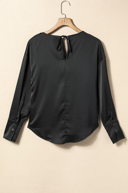 Blusa elegante de manga larga con cuello vuelto negro