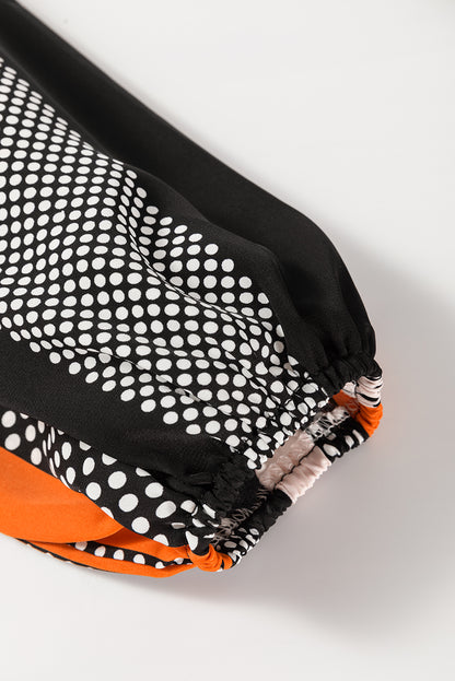 Chemisier orange à manches bouffantes et rayures verticales à pois