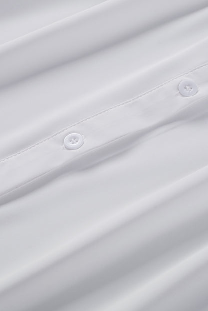 Chemisier boutonné à manches bouffantes de couleur unie