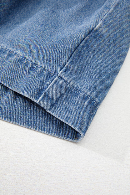 Chemise en jean péplum bleu crépuscule à manches bouffantes et nouée sur le devant