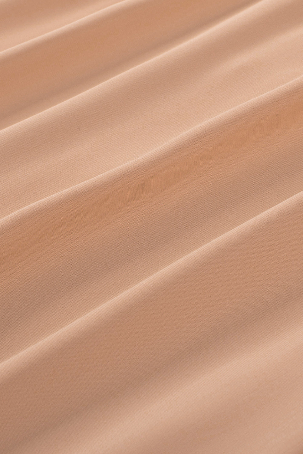 Chemisier boutonné à manches bouffantes de couleur unie