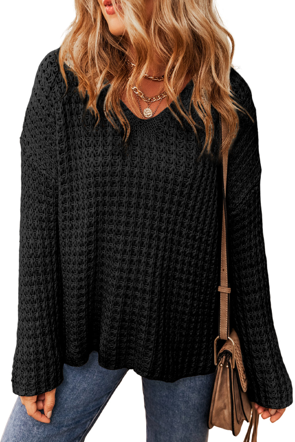 Pull noir à col en V et crochet ajouré 