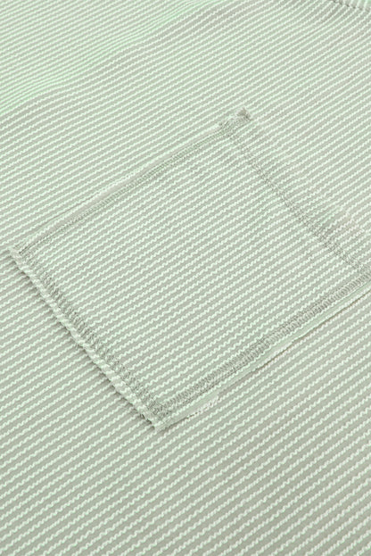 Haut oversize vert côtelé à manches retroussées et poche poitrine