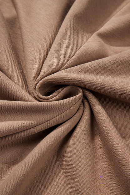 Robe courte à manches longues et col rond en chèvre avec ourlet à volants superposés