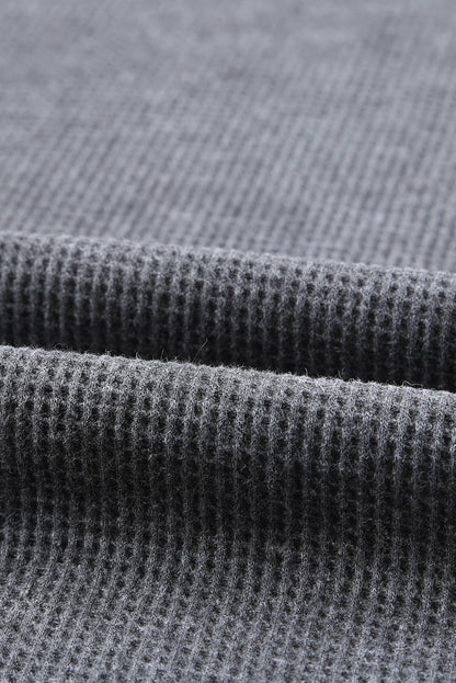 Top tipo jersey con abertura lateral y punto tipo gofre 