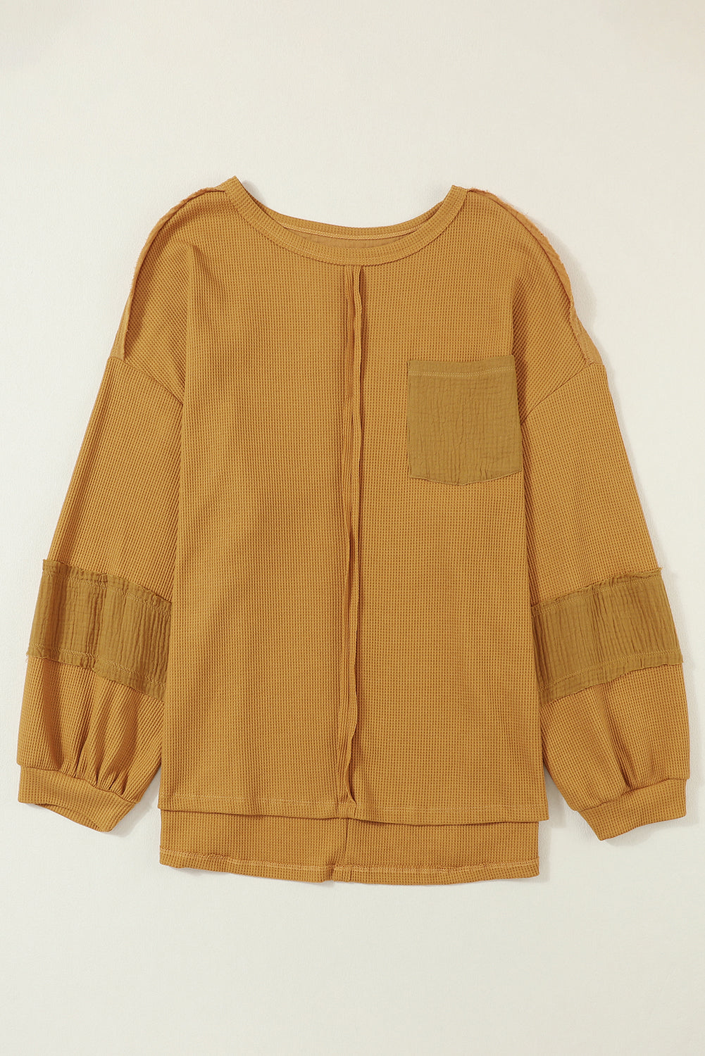 Haut en tricot gaufré à manches bouffantes et coutures apparentes