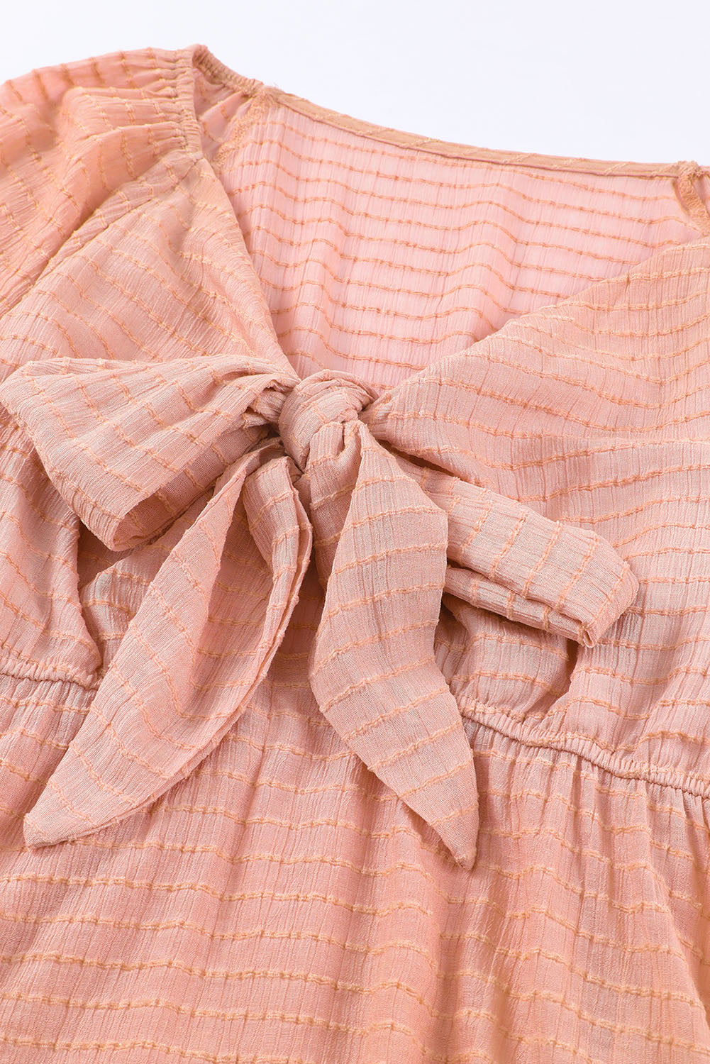 Chemisier péplum texturé noué sur le devant 