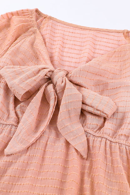 Chemisier péplum texturé noué sur le devant 