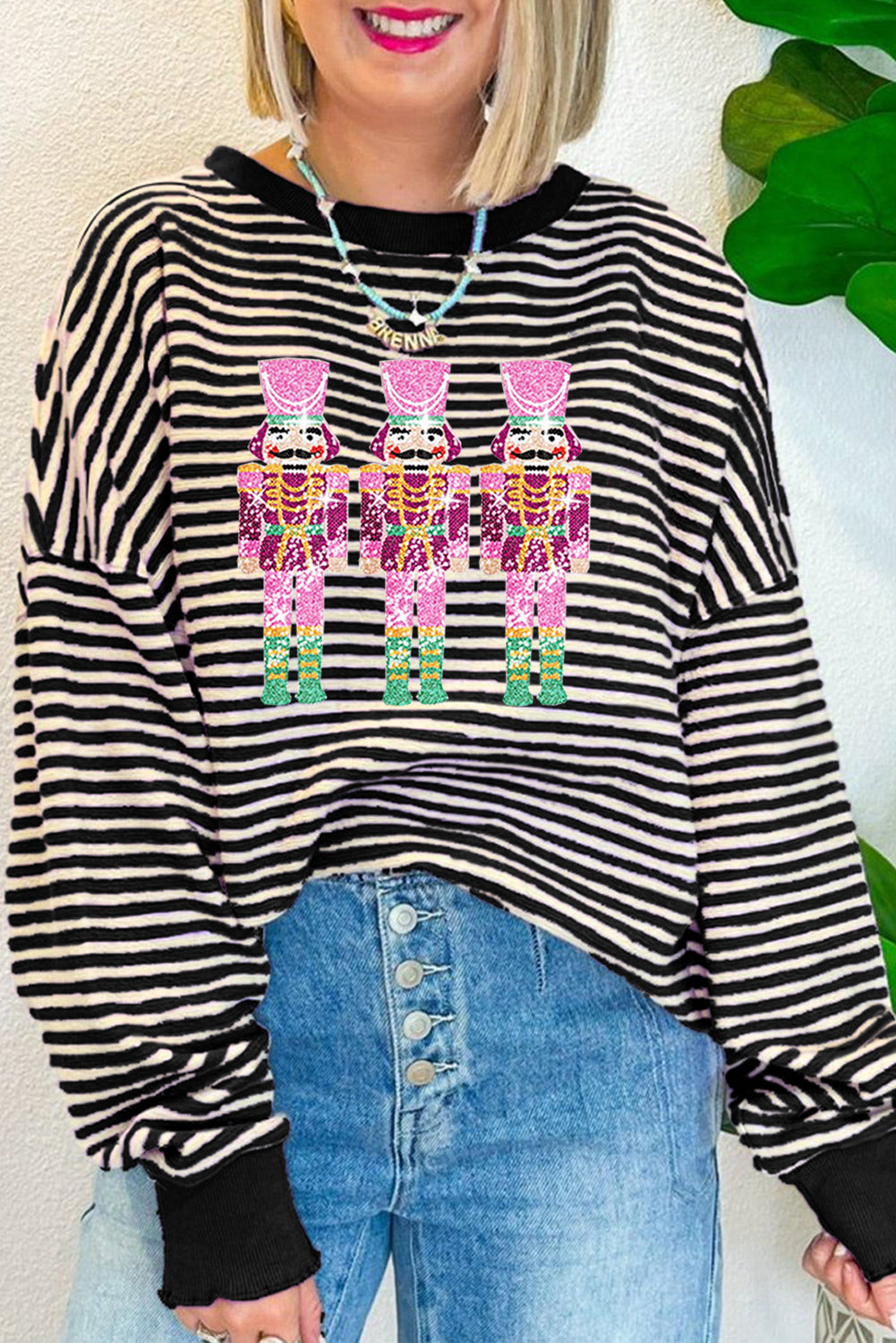 Haut ample à manches longues et épaules tombantes en forme de poupée Casse-Noisette à rayures noires et paillettes