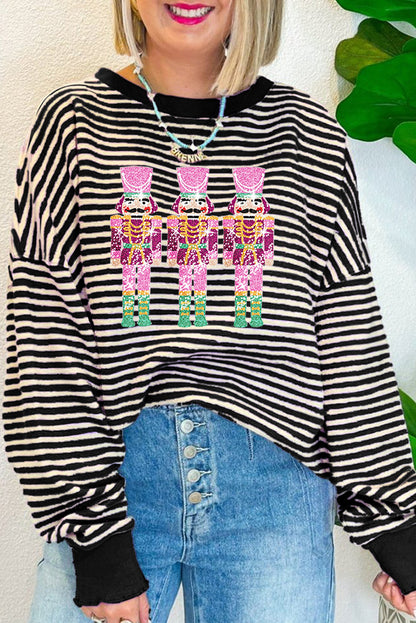 Haut ample à manches longues et épaules tombantes en forme de poupée Casse-Noisette à rayures noires et paillettes