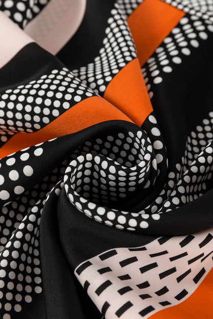 Chemisier orange à manches bouffantes et rayures verticales à pois