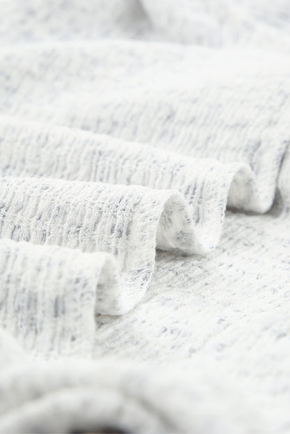 Blusa con mangas de burbuja con volantes arrugados y estampado floral negro 