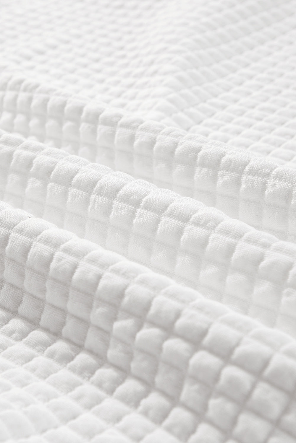 Haut à manches longues et col sportif blanc matelassé