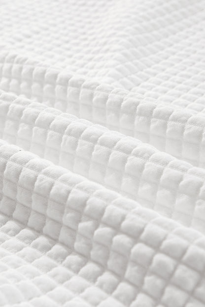 Haut à manches longues et col sportif blanc matelassé