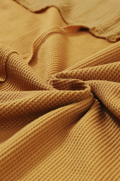 Haut en tricot gaufré à manches bouffantes et coutures apparentes