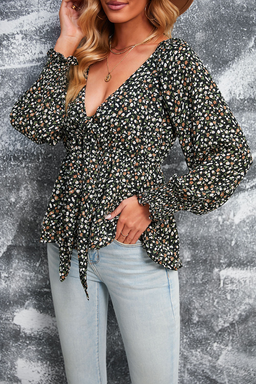 Blusa de manga larga con volantes y lazo delantero con estampado floral